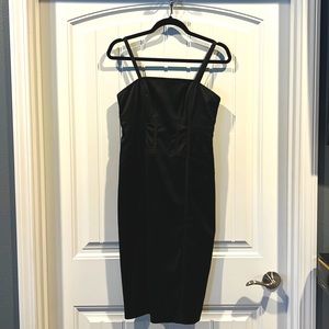 Nine West black dress - zipper down the back. Form fitting slight give, size 4.